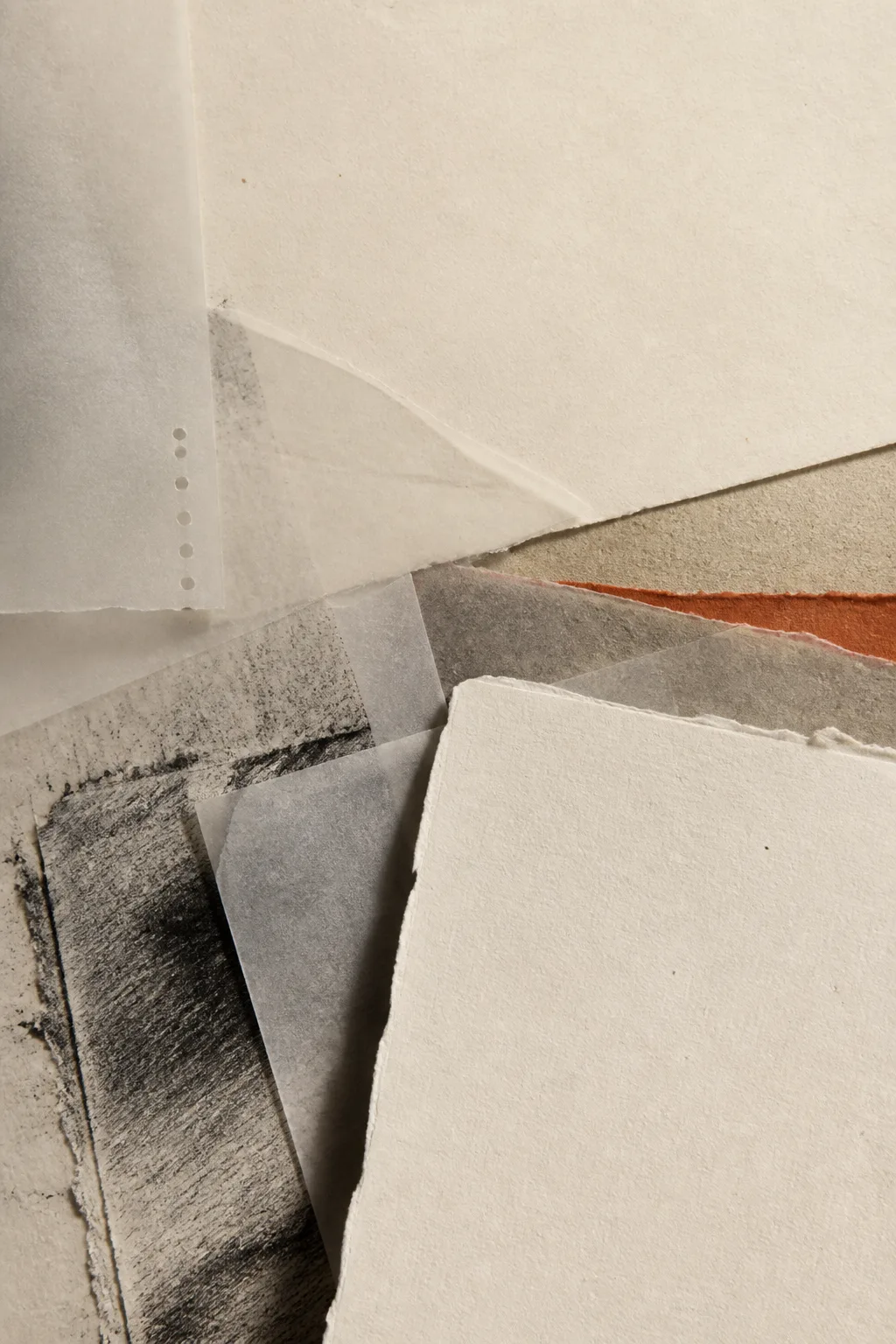 Layered deckled papers, translucent sheets, charcoal transfer textures and a narrow oxide edge.